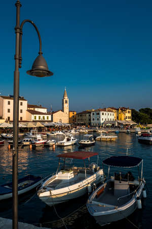 Picturesque Village Fazana In Croatia With Old Church And Boats In Harborのeditorial素材