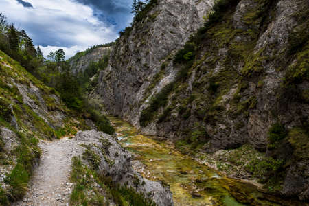 Hiking Trail Beneath Wild Mountain River In ÃtschergrÃ¤ben in Austriaの写真素材
