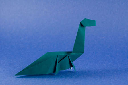 An origami folding  in the shape of a seismosaurus dinosaurの写真素材
