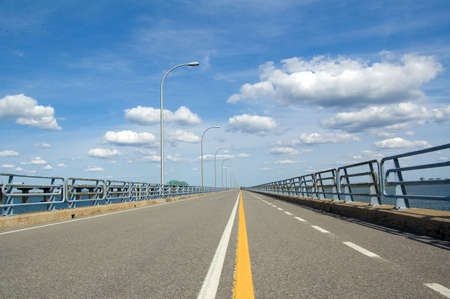 A bicycle lane on a very long bridge