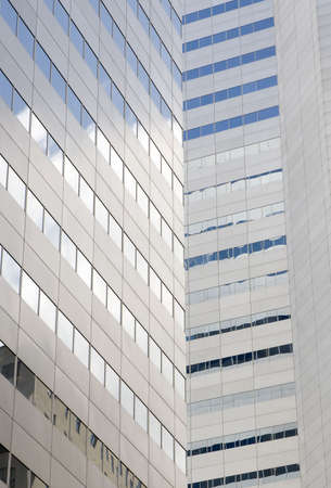 a modern grey building in downtown montreal