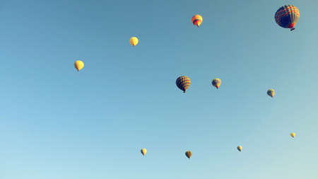 Balloons flying over Cappadociaの写真素材