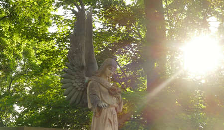 Statue of an angel on a grave. Symbol of Christian values ââand resurrection.の写真素材
