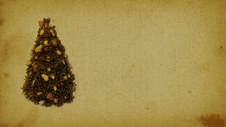 Ecological Christmas tree made of natural materials. A place for Christmas greetings - sepia retro style card.の写真素材