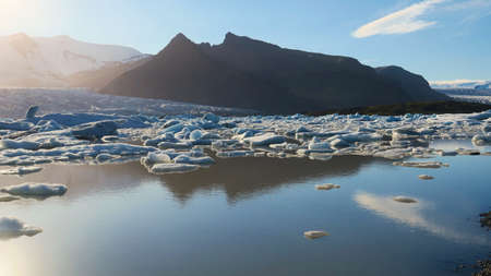 Melting ice blocks dissolving in the lake - one of the many glacial lagoons in Iceland.