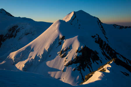 Swiss mountain at sunriseの写真素材