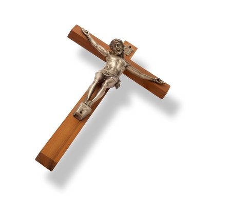Crucifix with figure of Jesus on white background, horizontal with shadowの写真素材