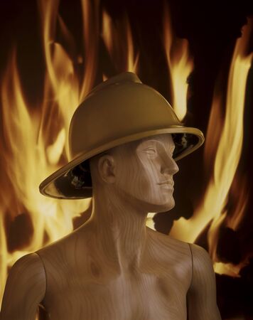 Wooden mannequin wearing fireman's helmet in front of flame backgroundの写真素材