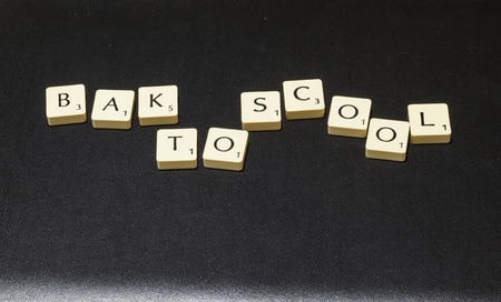 Game letter tiles purposely mis-spelling bak to scoolのeditorial素材