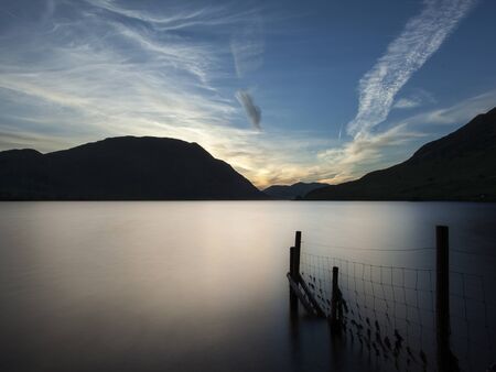 Crummock Water looking towards Mellbreak at sunset, long exposure, horizontalの写真素材