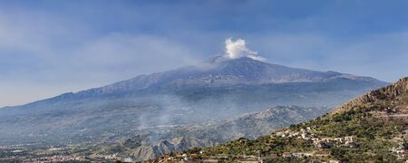 Panoramic view of Mount Etna with steamの写真素材