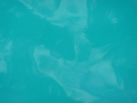 Background of abstract reflections in blue waterの写真素材