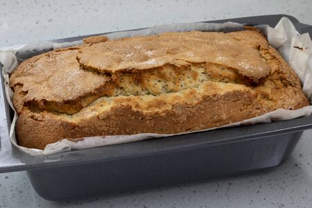 freshly baked home made lemon cake in cake tinの写真素材