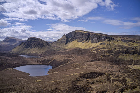 the quiraing near staffin isle of skye sunny day looking south over two small lochs