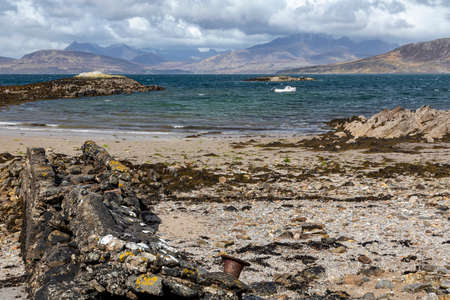 beach at ord isle of skye looking north towards the cuillin hillsの写真素材