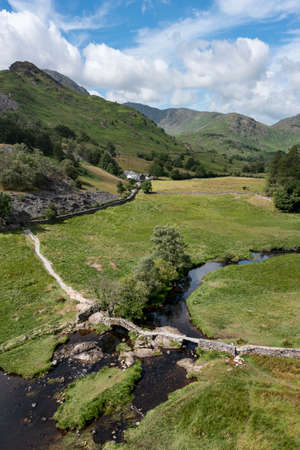 slaters bridge in little langdale looking towards the tilberthwaite fells vertical panorama