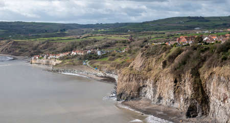 view of robin hoods bay village from the north headlandの写真素材