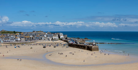 panoramic view of st ives beach town and harbour cornwall with many peopleの写真素材