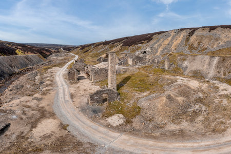 ruins of the old gang lead mine in the hills above reeth in the yorkshire dales wide elevated viewの写真素材