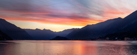 dramatic sunset over lake como panoramaの写真素材