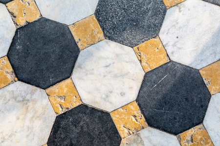 close up of pattern of marble floor with square and octagonal tiles in different colours