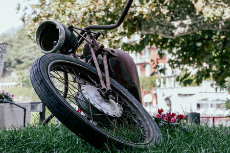 old and grungy abandoned motorcycle close up from frontの写真素材