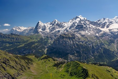 the mountains eiger monch and jungfrau above murren village in the bernese oberland from Birg sunny day blue skyの写真素材
