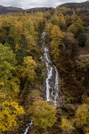 sour milk gill waterfall on red pike at buttermere lake district with autumn colours elevated viewの写真素材