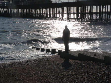 Figure on beach at Hastings East Sussex ukの写真素材