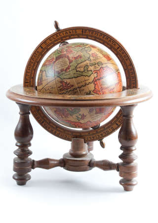 Old wooden globe on wooden stand showing north america on white isolated background.の写真素材