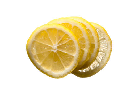 Four fresh yellow lemon slices stacked on top of each other on a white isolated background.の写真素材