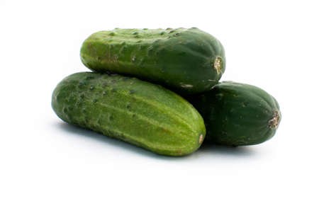 Fresh cucumbers on isolated white backgroundの写真素材