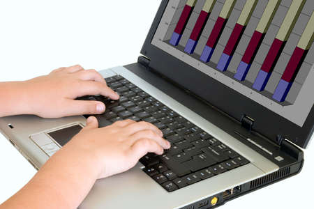 a whizz kid on a laptopの写真素材