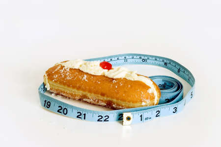 watch your weight eating that lovely cream cake!の写真素材