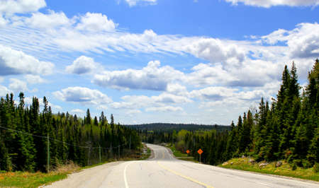 Beautiful scenic highway winding trough forest landscape in Ontario / Canadaの写真素材