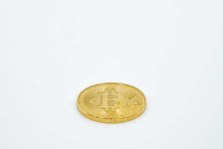Close Up Shot of Golden Bitcoins on a white background: Future Currency - fincance concept - free white spaceの写真素材