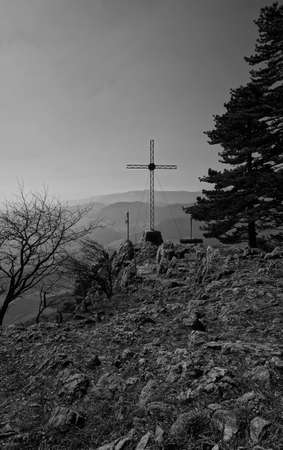 Summit cross in the austrian alps / Beautiful view into the surround moutain landscapeの写真素材