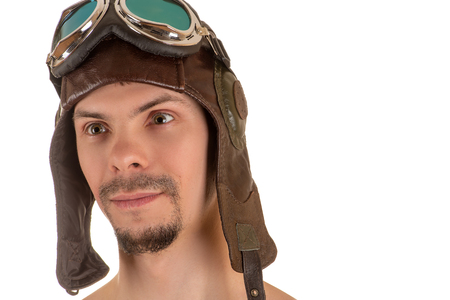 portrait of smiling man with mad look in flight flying helmet and gogglesの写真素材