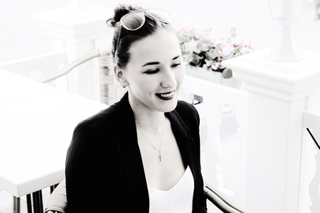 girl in a business suit in summer Cafe, Color filtered effectの写真素材