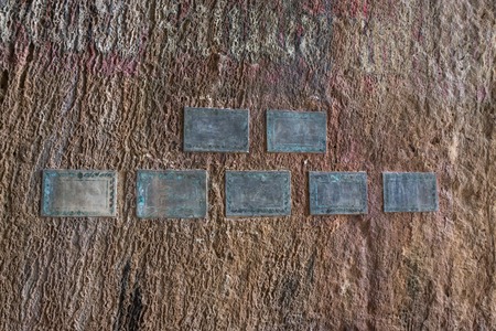 Ancient tablets in colored multicolored paint groundの写真素材