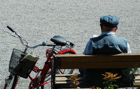Old men reading on the benchの写真素材