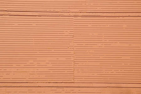 Orange wall surface with lines and texturesの写真素材