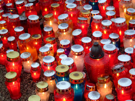 Candles in colors staying in the autumn rainの写真素材