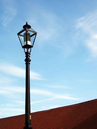 Old fashion street lamp and bright blue skyの写真素材