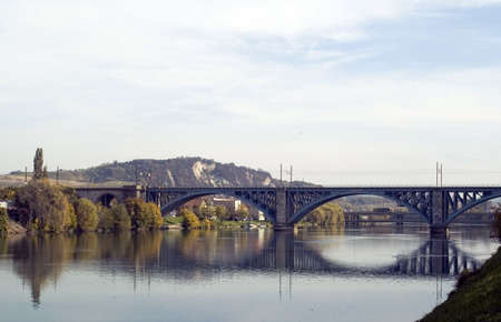 Long railway bridge over river in daytimeの写真素材