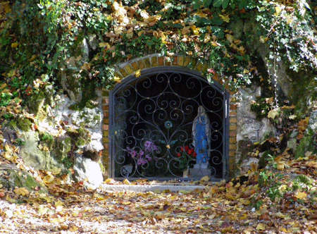 Small shrine with Virgin Marry stuatue in the rockの写真素材
