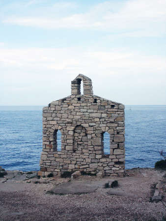 Little stone church on the Istrian shoreの写真素材