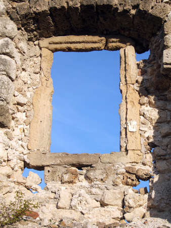 Ancient stone window and clear blue skyの写真素材