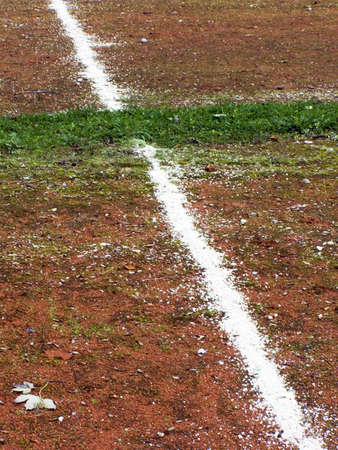 White line from sand on the red backgroundの写真素材