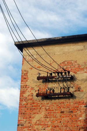 Old red brick wall and old electric wireの写真素材